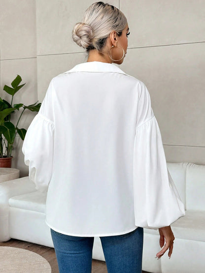 Long-fitting, puff-sleeved top with a semi-open collar